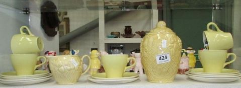 A Wade tea set, lidded vase and milk jug