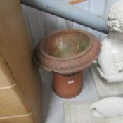 A chimney pot and a garden urn. a/f