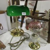 A Victorian style desk lamp with green shade and a small lamp with pink shade