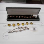A silver bracelet set amber, a silver bracelet and a white metal bracelet set citrine