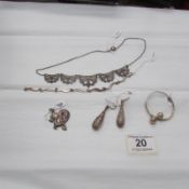 A child's silver bracelet, silver earrings, silver bracelet, silver necklace and silver pendant