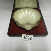 A cased silver shell dish with frosted glass lining