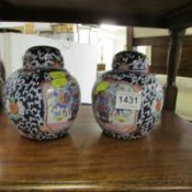 2 Oriental ginger jars with covers