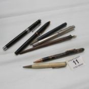 7 assorted vintage pens and pencils