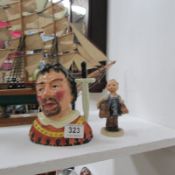 A Sylvac Sheriff of Nottingham character jug and a Hummel figurine 'Boots'