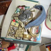 A box of miscellaneous brassware including Lincoln Imp, candlesticks, vintage BBC headphones etc