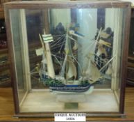 A model galleon within glazed and oak display cabinet case, dated 1938