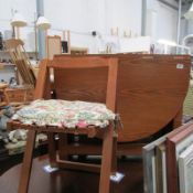 A drop leaf table and 2 folding chairs