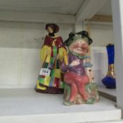 A Royal Doulton 'The Parson's daughter' (repaired) and an unusual Melba ware Mr Punch (repaired)
