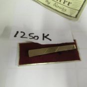 A 9ct gold tie pin with certificate