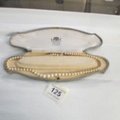 An imitation pearl necklace
