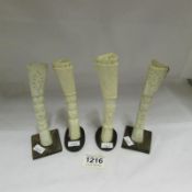 4 carved bone vases