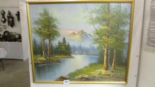 An oil on canvas mountain scene signed G Whitman