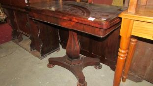 A Victorian rosewood fold over table