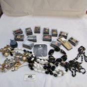 A mixed lot of jewellery, badges etc