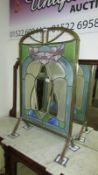 A brass and stained glass fire screen (some glass a/f)