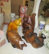 3 pottery cats and 3 wooden cats