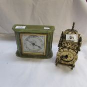 An Elliot onyx clock (small chip on base) and a brass clock