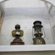 A Hurricane lamp and an oil lamp base