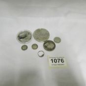 A quantity of silver coins and a silver ring