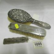 2 silver backed brushes and a silver comb case