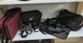 A quantity of camera's, binoculars etc