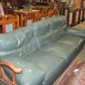 A green leather 3 seat sofa