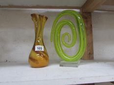 An art glass vase and a studio glass ornament