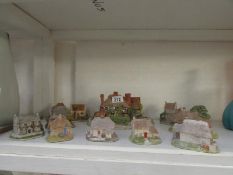 A large Lilliput Lane cottage and 9 smaller ones