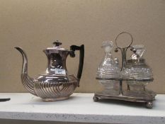 A silver plated coffee pot and 4 bottle cruet set