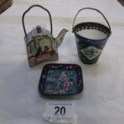 A miniature enamel teapot decorated cats, a miniature enamel bucket and an enamel pin tray