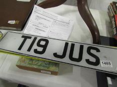 A Number plate T19 KUS with retention document