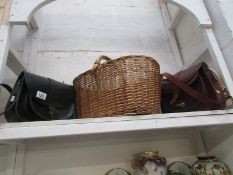 A wicker basket and 2 leather hand bags