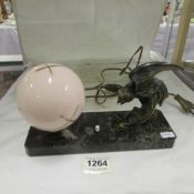 A French Deco spelter parrot and butterfly mood lamp on marble base