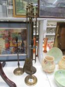 A companion set and a pair of tall candlesticks