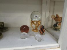 A Crystal ball and 5 glass paperweights