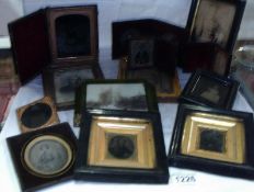 A quantity of miniature pictures and frames