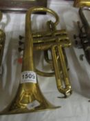A brass cornet by Lark