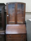 An oak bureau book case