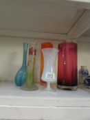 A hand painted spill vase, a cranberry cylinder vase and 3 others