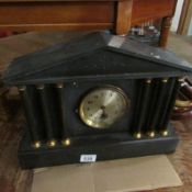 A Palladian style black slate mantel clock