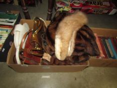 A box of furs and hand bags