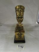 A polished brass bust of Nefertiti