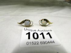 A pair of 9ct gold opal leaf earrings