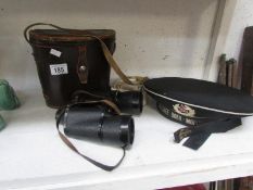 A Russian hat, a belt and a pair of binoculars