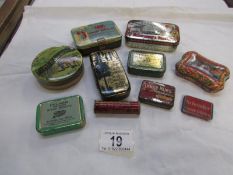 A mixed lot of small old tins