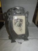 An Art Nouveau style photo frame