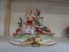 A figurine of lovers by Merli