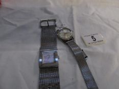 A DKNY and a Titus wristwatches