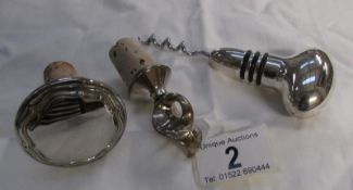 A silver plated corkscrew and 2 wine bottle